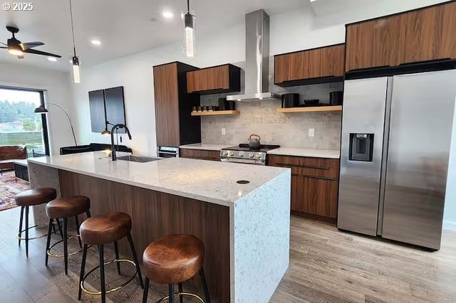 280 NW Huckleberry St, Waldport, OR 97394 - kitchen with appliances with stainless steel finishes, wall chimney exhaust hood, open shelves, light wood-style flooring, and recessed lighting
