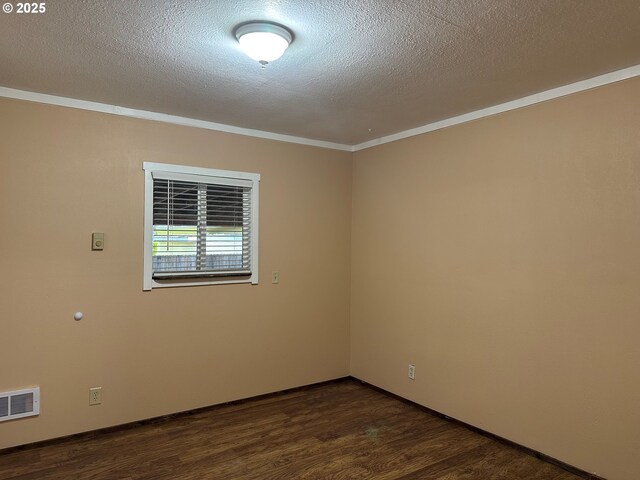 2735 W Jay Ave, Roseburg, OR 97471 - spare room featuring crown molding, dark wood-style floors, a textured ceiling, and baseboards