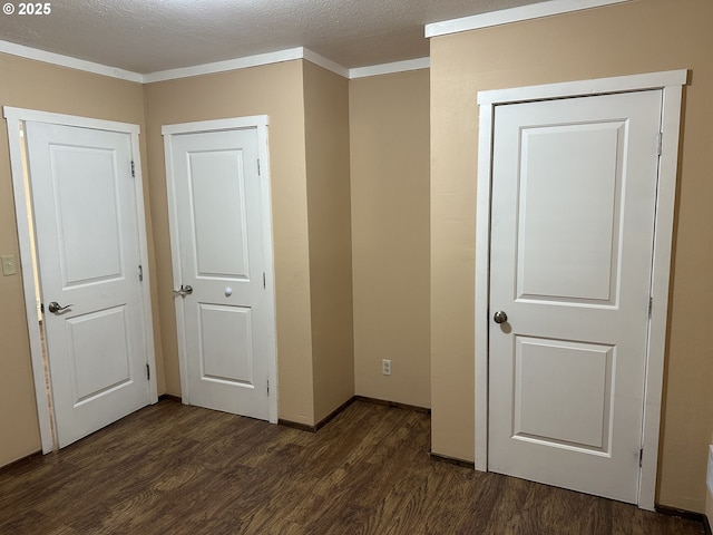 2735 W Jay Ave, Roseburg, OR 97471 - unfurnished bedroom with wood finished floors, baseboards, and a textured ceiling