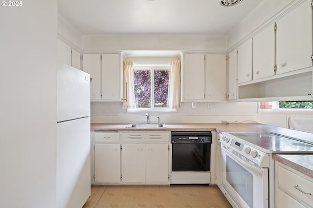 10438 NE Davis St, Portland, OR 97220 - kitchen with white appliances, a sink, healthy amount of natural light, and light countertops