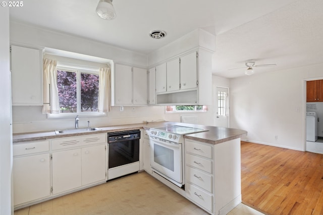 10438 NE Davis St, Portland, OR 97220 - kitchen with dishwasher, white range with electric stovetop, a sink, a peninsula, and washer / dryer