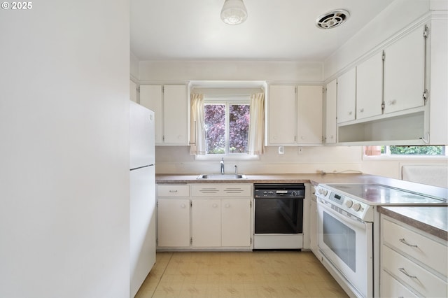 10438 NE Davis St, Portland, OR 97220 - kitchen with white appliances, a sink, plenty of natural light, and white cabinets