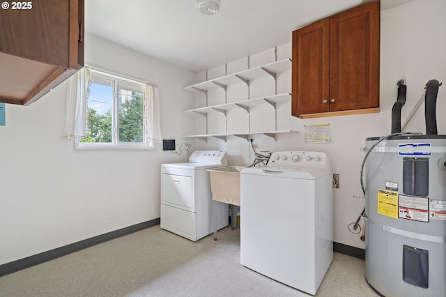 10438 NE Davis St, Portland, OR 97220 - washroom featuring strapped water heater, cabinet space, independent washer and dryer, and baseboards
