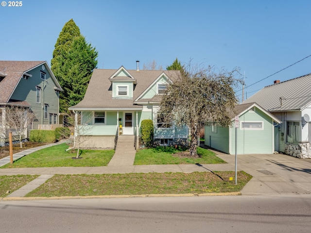 view of front of house featuring a garage, a front lawn, and concrete driveway