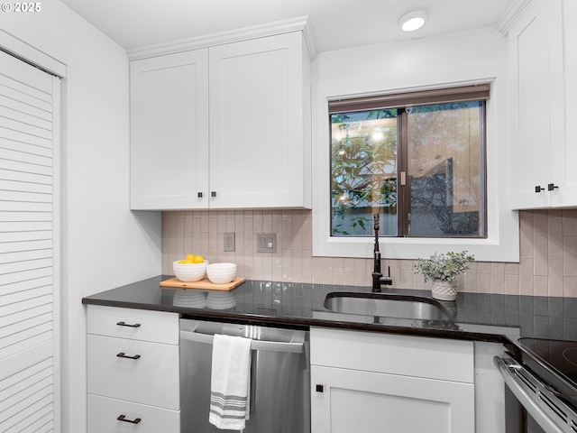 kitchen with white cabinets, dishwasher, sink, and tasteful backsplash