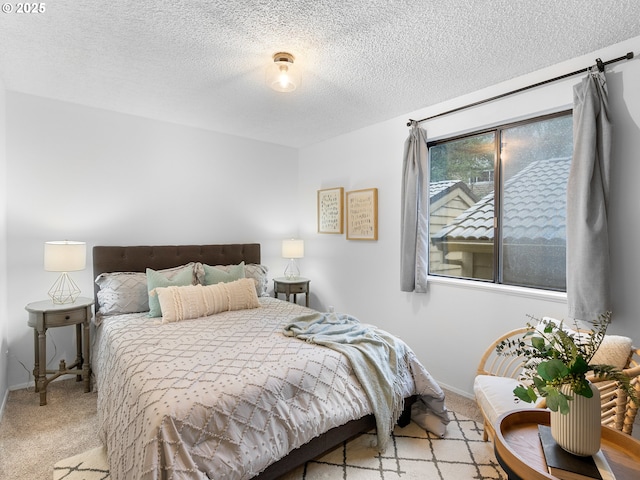 carpeted bedroom with a textured ceiling and multiple windows