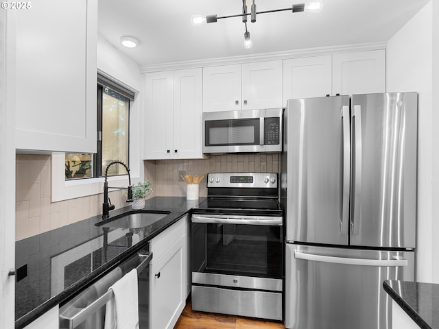 kitchen with white cabinets, stainless steel appliances, and sink