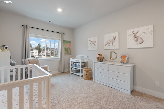16679 SW Darwin Loop, Portland, OR 97224 - bedroom featuring a nursery area, carpet flooring, and baseboards