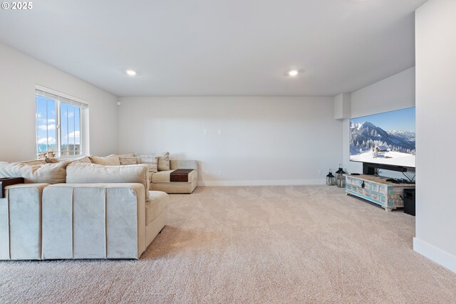 16679 SW Darwin Loop, Portland, OR 97224 - carpeted living area featuring baseboards and recessed lighting