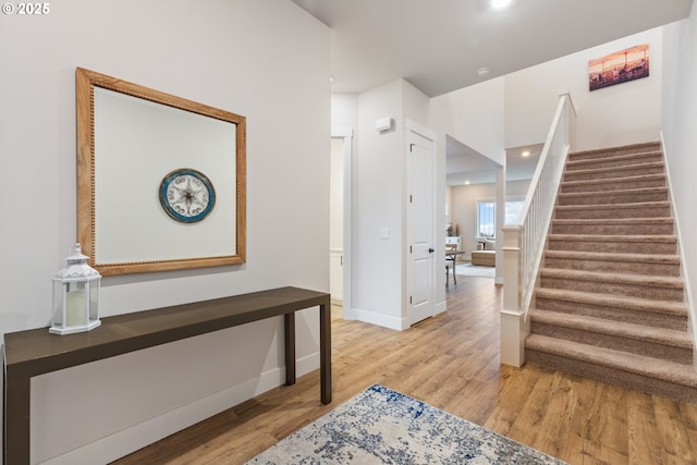 16679 SW Darwin Loop, Portland, OR 97224 - entryway with light wood finished floors, stairway, baseboards, and recessed lighting