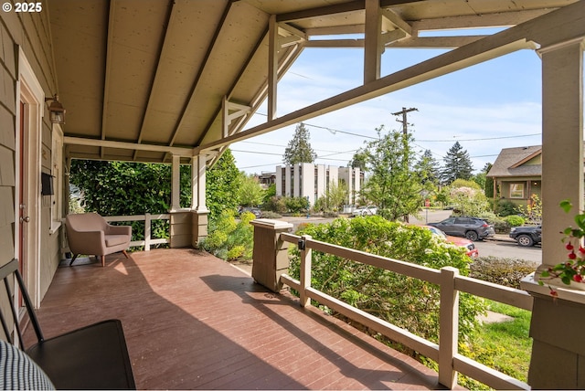 wooden terrace with a porch