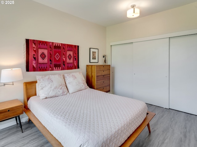 12600 SW Crescent St Unit 213, Beaverton, OR 97005 - bedroom featuring wood finished floors and a closet