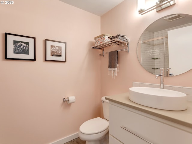 12600 SW Crescent St Unit 213, Beaverton, OR 97005 - bathroom with toilet, vanity, a tile shower, and baseboards