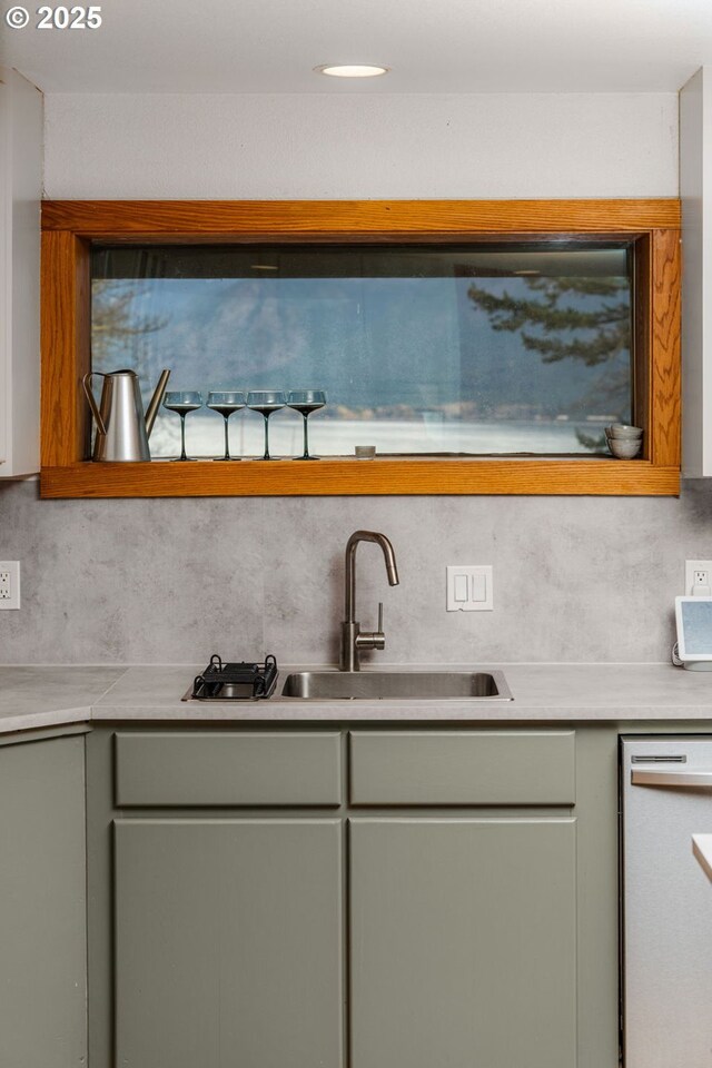 91 Sprague Landing Rd, Stevenson, WA 98648 - kitchen featuring dishwashing machine, gray cabinetry, light countertops, and decorative backsplash
