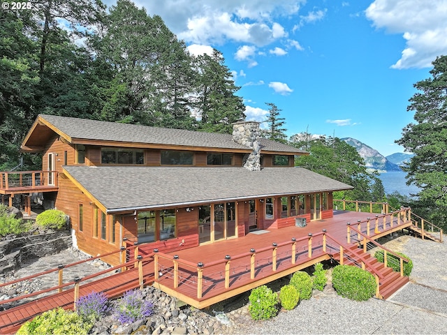 91 Sprague Landing Rd, Stevenson, WA 98648 - back of house featuring a shingled roof, a chimney, and a deck with mountain view