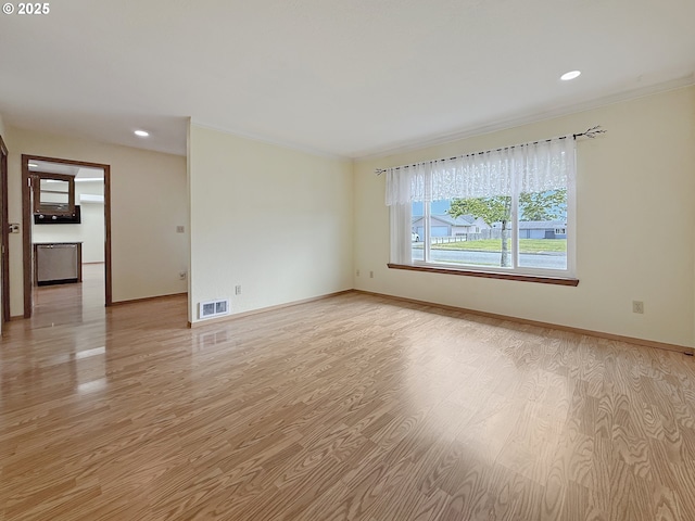 550 Velopa Ct, Brookings, OR 97415 - empty room with light wood-style floors, baseboards, ornamental molding, and recessed lighting