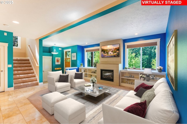 35908 Chinook St, Sandy, OR 97055 - living room featuring stairway, a large fireplace, and recessed lighting