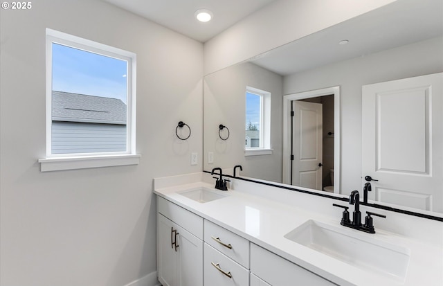 8728 S 4th Way, Ridgefield, WA 98642 - full bath with double vanity, toilet, baseboards, and recessed lighting