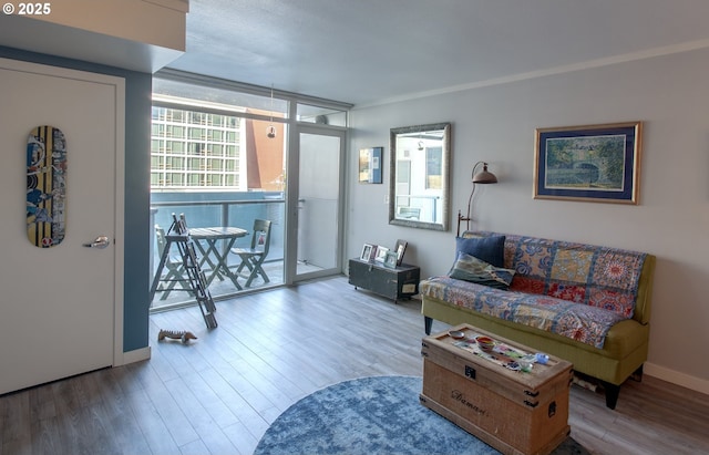 533 NE Holladay St Unit 308, Portland, OR 97232 - living room featuring wood finished floors and a wall of windows