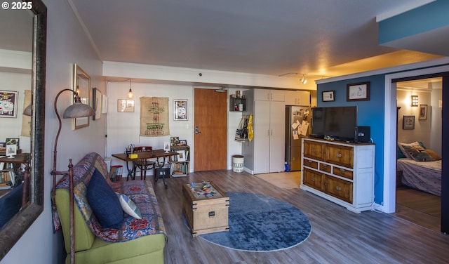 533 NE Holladay St Unit 308, Portland, OR 97232 - living area featuring wood finished floors and crown molding