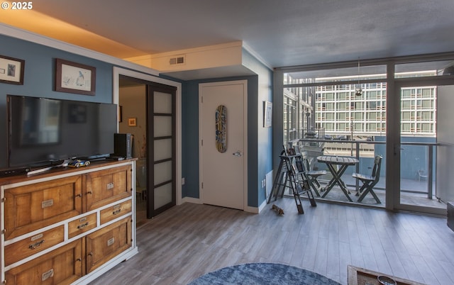 533 NE Holladay St Unit 308, Portland, OR 97232 - foyer entrance featuring wood finished floors and expansive windows