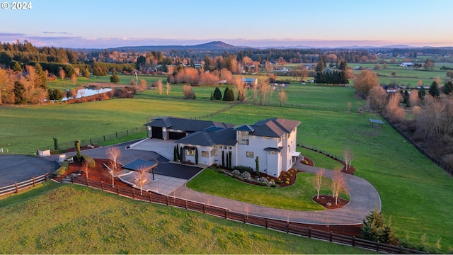 aerial view at dusk with a rural view