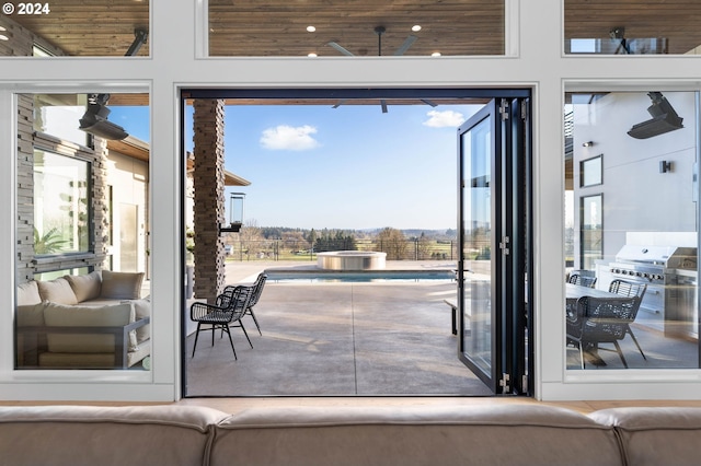 doorway to outside with wooden ceiling, recessed lighting, and a healthy amount of sunlight