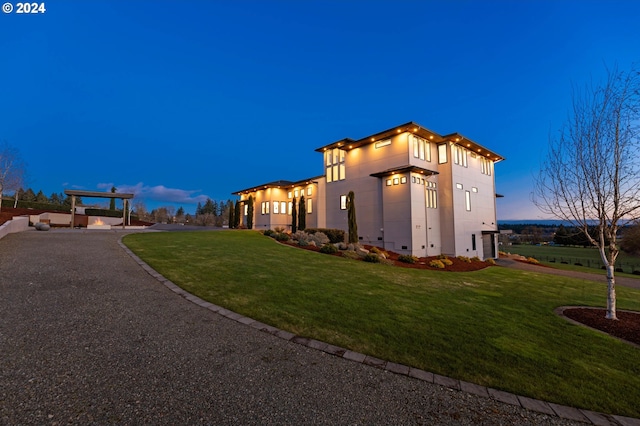 view of front of home with crawl space, a front yard, and stucco siding