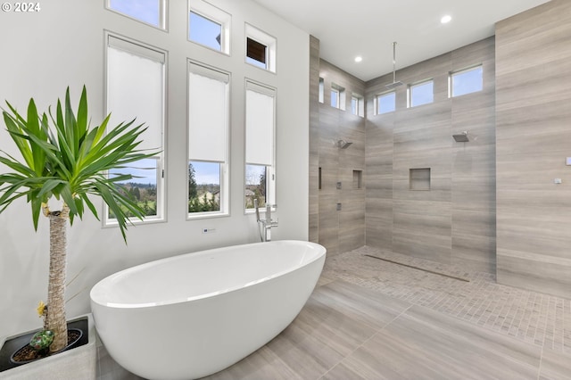 bathroom featuring a soaking tub, recessed lighting, and walk in shower