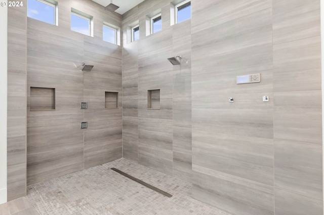 bathroom featuring tiled shower