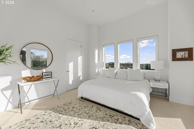 carpeted bedroom with baseboards