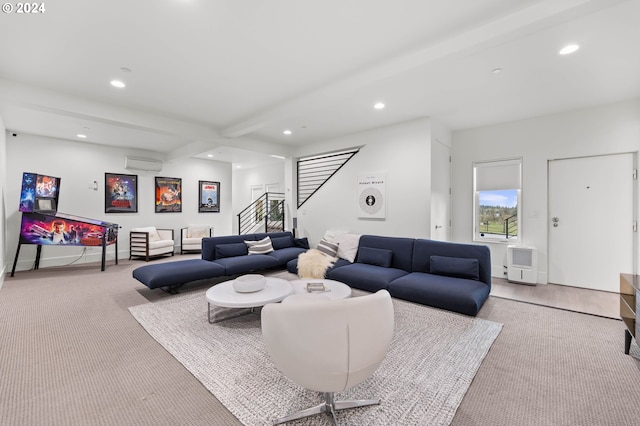 living room featuring baseboards, beamed ceiling, an AC wall unit, stairs, and recessed lighting