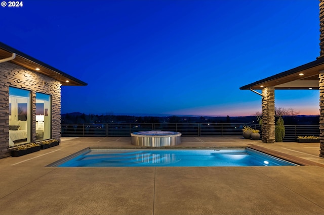 view of swimming pool with an outdoor hot tub, fence, a patio area, and a fenced in pool