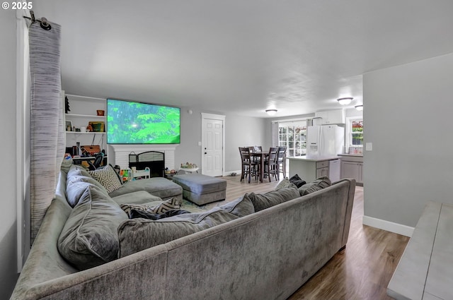 1533 Sequoia Ave, Springfield, OR 97477 - living area with wood finished floors, baseboards, and a fireplace