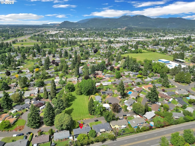 1533 Sequoia Ave, Springfield, OR 97477 - aerial overview of property's location with a mountain backdrop and nearby suburban area