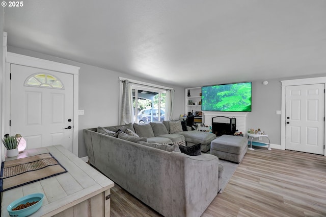 1533 Sequoia Ave, Springfield, OR 97477 - living area featuring wood finished floors, a fireplace, and baseboards