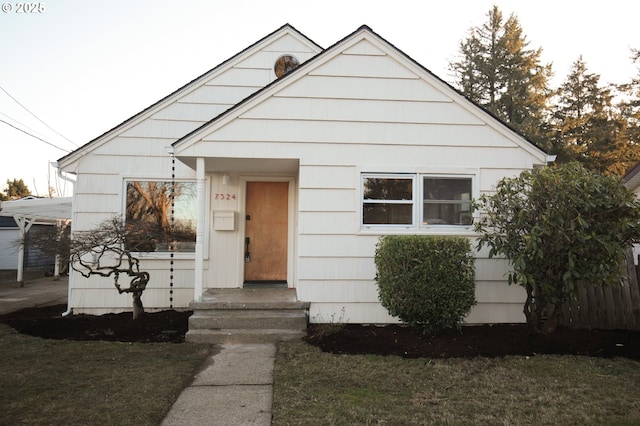 bungalow with a front yard