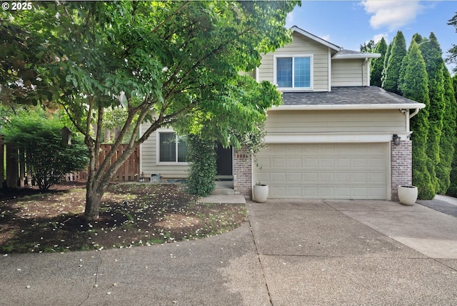 5966 Frost Ln, Lake Oswego, OR 97035 - obstructed view of property featuring concrete driveway, a garage, brick siding, and a shingled roof