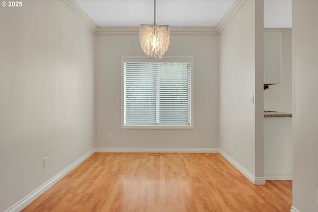 5966 Frost Ln, Lake Oswego, OR 97035 - unfurnished dining area featuring light wood-style floors, a chandelier, and ornamental molding