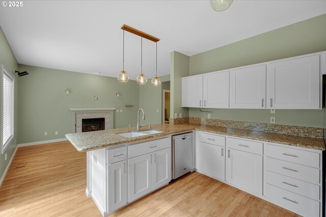 5966 Frost Ln, Lake Oswego, OR 97035 - kitchen featuring stainless steel dishwasher, white cabinetry, light wood-type flooring, a peninsula, and open floor plan