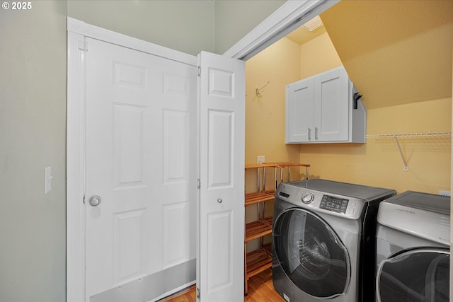 5966 Frost Ln, Lake Oswego, OR 97035 - laundry area featuring washing machine and clothes dryer, light wood-type flooring, and cabinet space