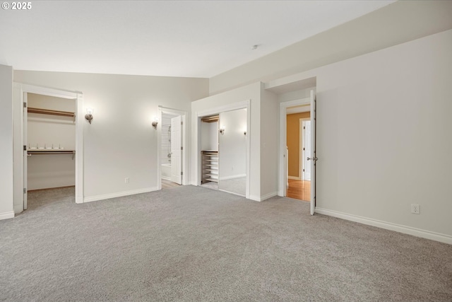 5966 Frost Ln, Lake Oswego, OR 97035 - unfurnished bedroom featuring carpet, a spacious closet, ensuite bathroom, and a closet