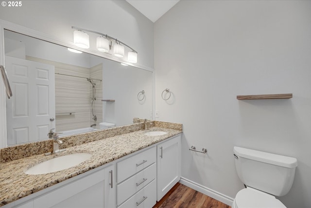 5966 Frost Ln, Lake Oswego, OR 97035 - bathroom with double vanity, shower / tub combination, wood finished floors, and vaulted ceiling