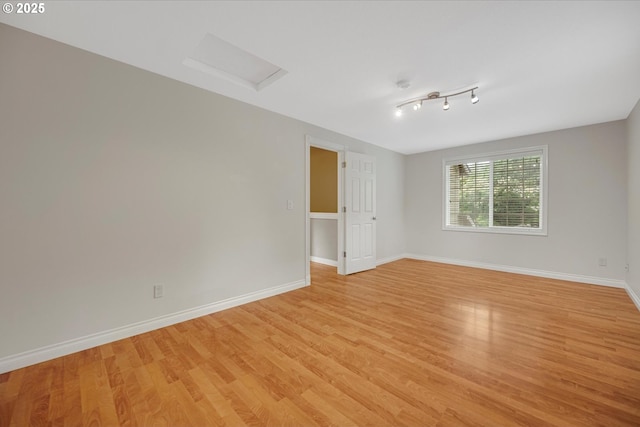 5966 Frost Ln, Lake Oswego, OR 97035 - spare room featuring attic access and light wood-type flooring