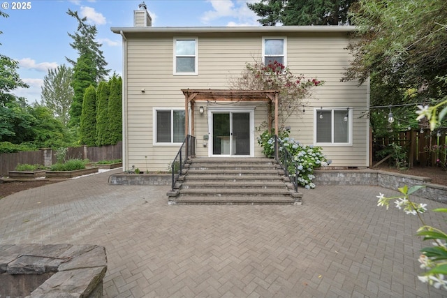 5966 Frost Ln, Lake Oswego, OR 97035 - back of house with a pergola, a patio area, a chimney, a fenced backyard, and entry steps
