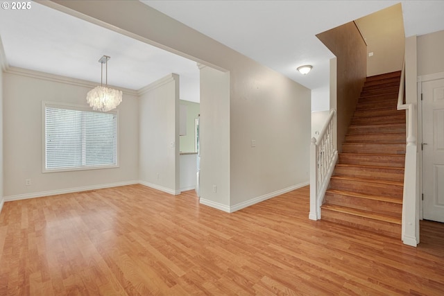 5966 Frost Ln, Lake Oswego, OR 97035 - stairway with a chandelier and wood finished floors