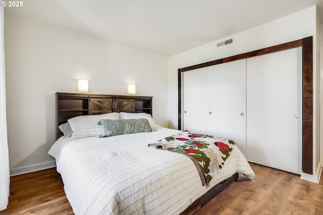 6645 W Burnside St Unit 515, Portland, OR 97210 - bedroom with wood-type flooring and a closet