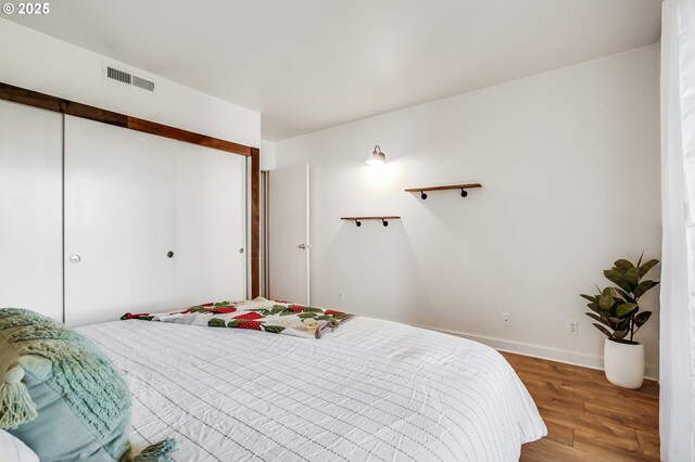 6645 W Burnside St Unit 515, Portland, OR 97210 - bedroom with wood-type flooring and a closet