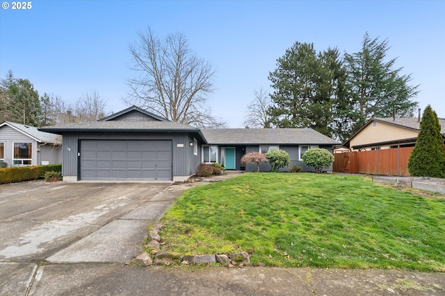 ranch-style home featuring a front yard and a garage