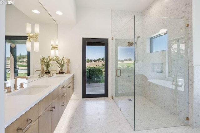 bathroom with tile patterned flooring, an enclosed shower, and vanity